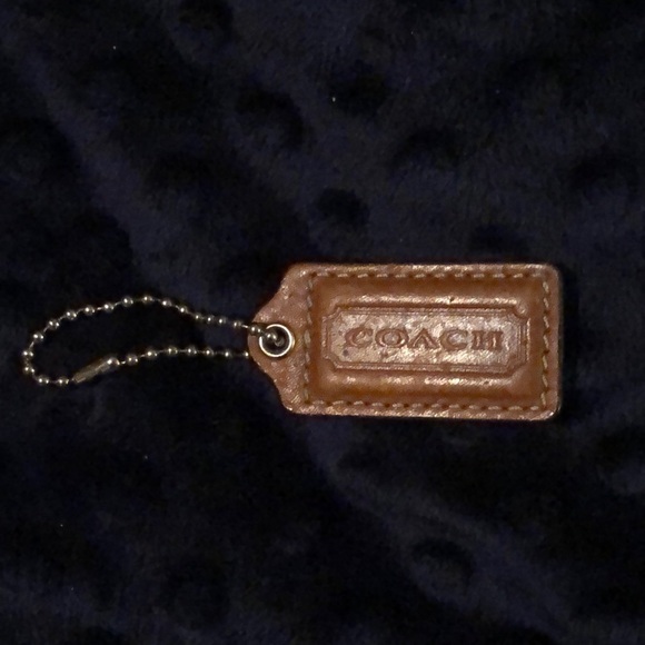 Another Coach charm for purses! Brown 2 inch and basic!